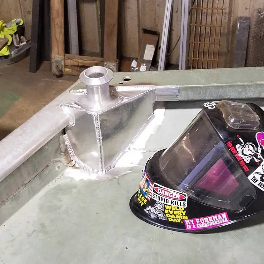 Stainless steel ductwork with welded collar joint and seamed construction on work table